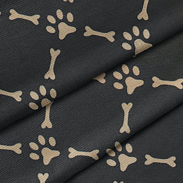 Tessuto Impermeabile Oxford - Ossa e zampe di cane su nero