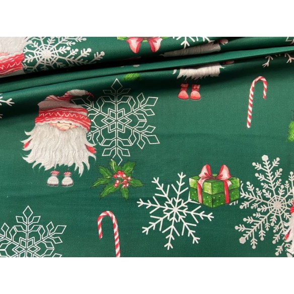Tessuto di cotone - Babbo Natale e fiocchi di neve su verde