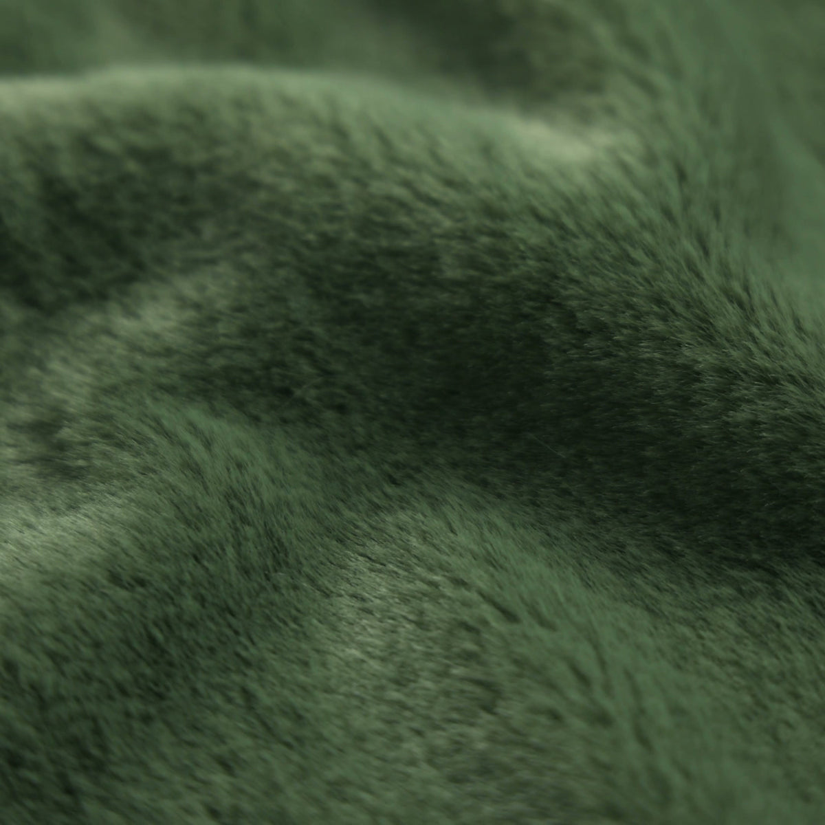 Tessuto in pelliccia ecologica lavorato a maglia CORTO - verde bottiglia